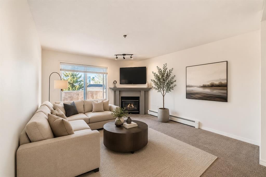 317-649 Marsh Road Ne, Calgary, AB - Indoor Photo Showing Living Room With Fireplace