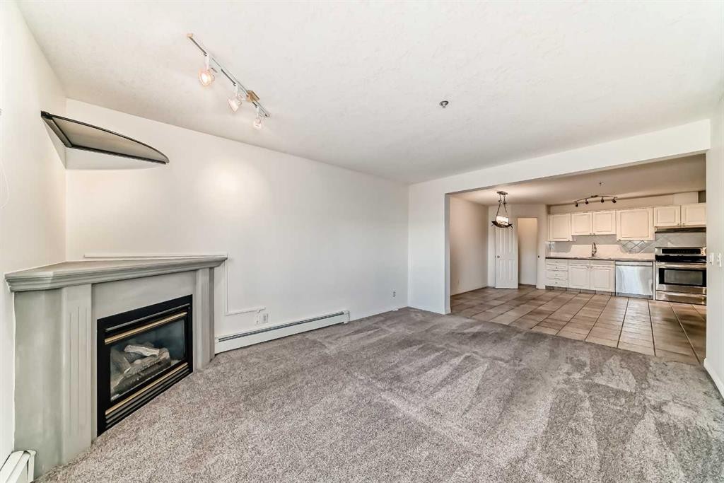 317-649 Marsh Road Ne, Calgary, AB - Indoor With Fireplace