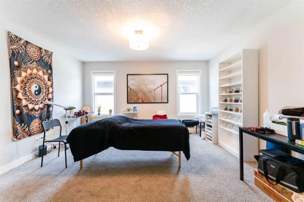 42 Buckskin Way, Cochrane, AB - Indoor Photo Showing Bedroom