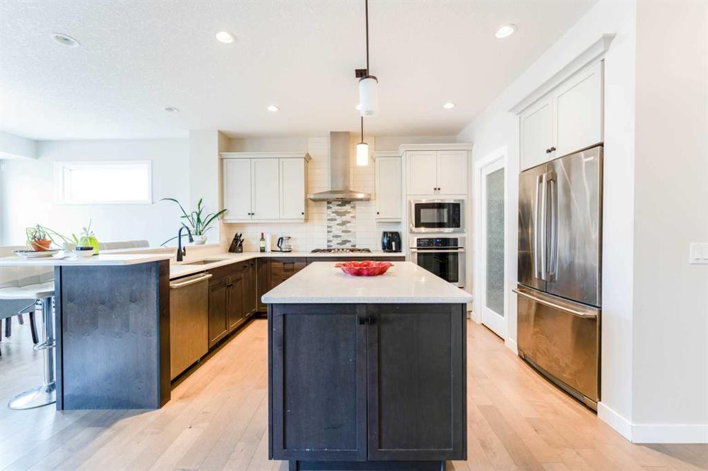 42 Buckskin Way, Cochrane, AB - Indoor Photo Showing Kitchen With Stainless Steel Kitchen With Upgraded Kitchen