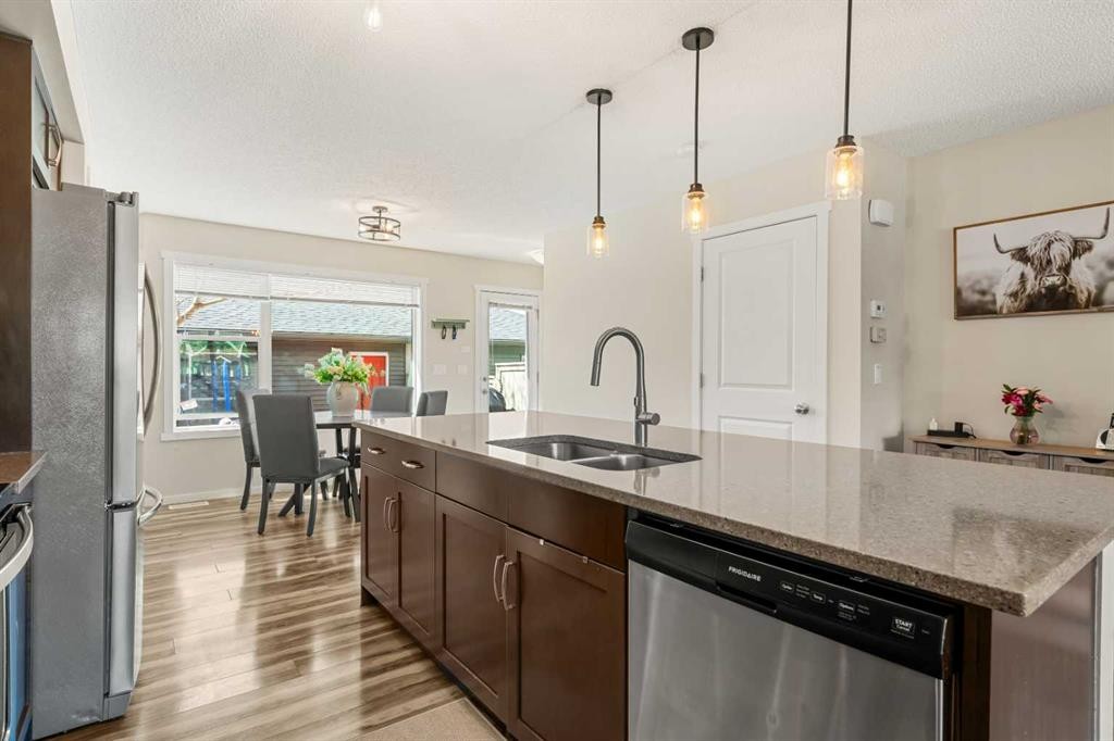 40 Sunvalley Road, Cochrane, AB - Indoor Photo Showing Kitchen With Double Sink With Upgraded Kitchen