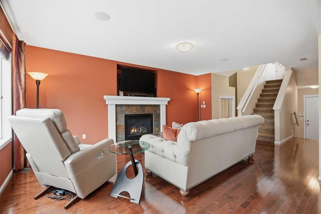 56 Everglen Way Sw, Calgary, AB - Indoor Photo Showing Living Room With Fireplace