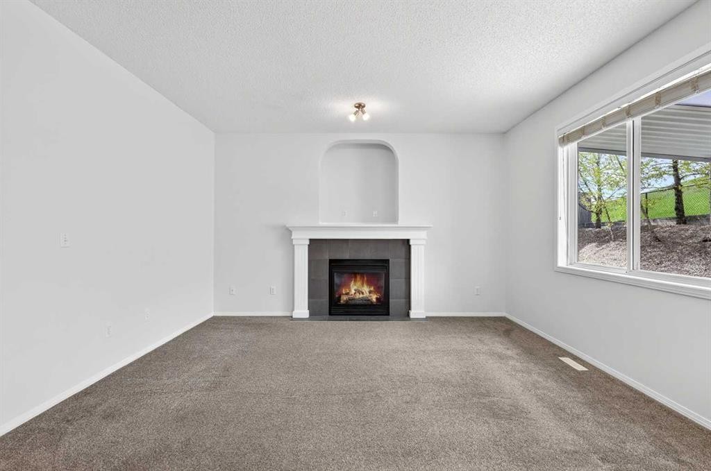 53 Royal Birch Way Nw, Calgary, AB - Indoor Photo Showing Living Room With Fireplace