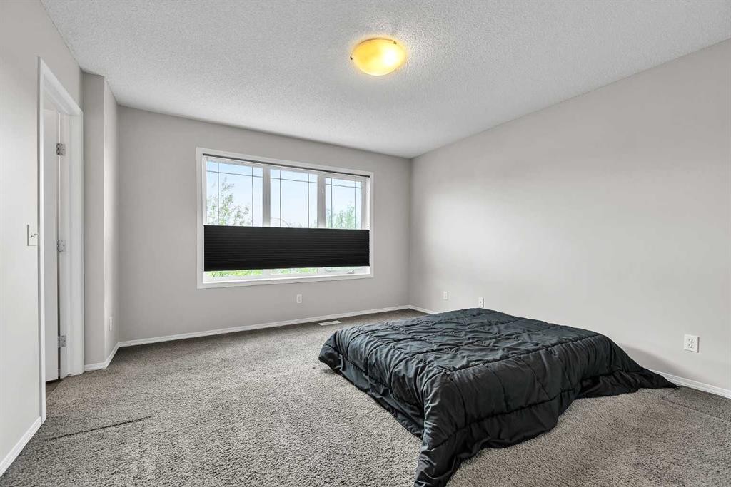 242 Copperstone Grove Se, Calgary, AB - Indoor Photo Showing Bedroom