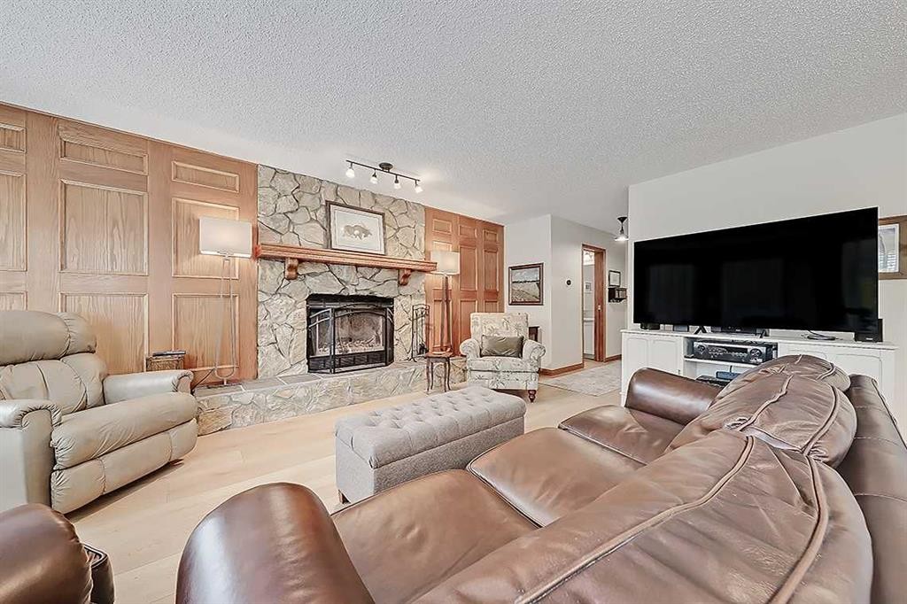 42 Sundown Close Se, Calgary, AB - Indoor Photo Showing Living Room With Fireplace
