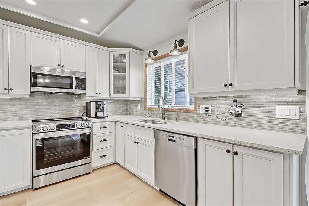 42 Sundown Close Se, Calgary, AB - Indoor Photo Showing Kitchen With Double Sink