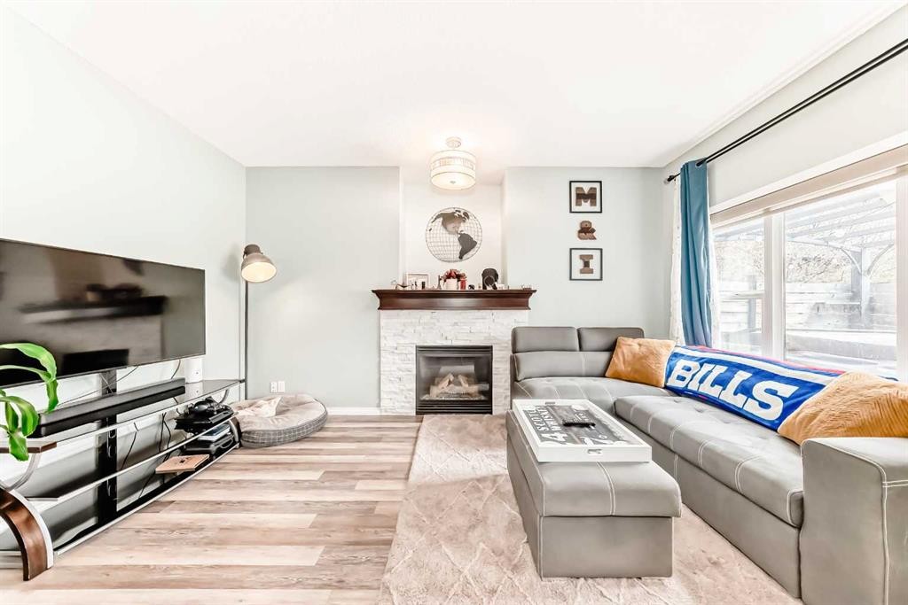 485 Cimarron Boulevard, Okotoks, AB - Indoor Photo Showing Living Room With Fireplace