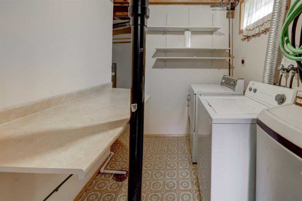 255 Huntcroft Road Ne, Calgary, AB - Indoor Photo Showing Laundry Room