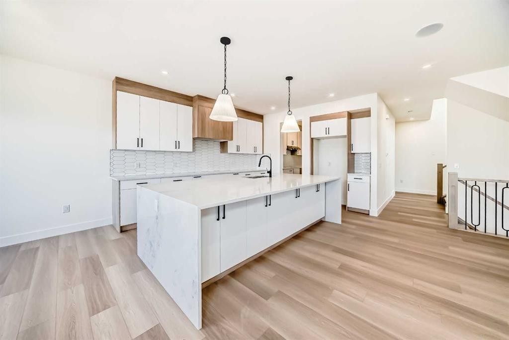 407 Rivercrest Road, Cochrane, AB - Indoor Photo Showing Kitchen With Upgraded Kitchen