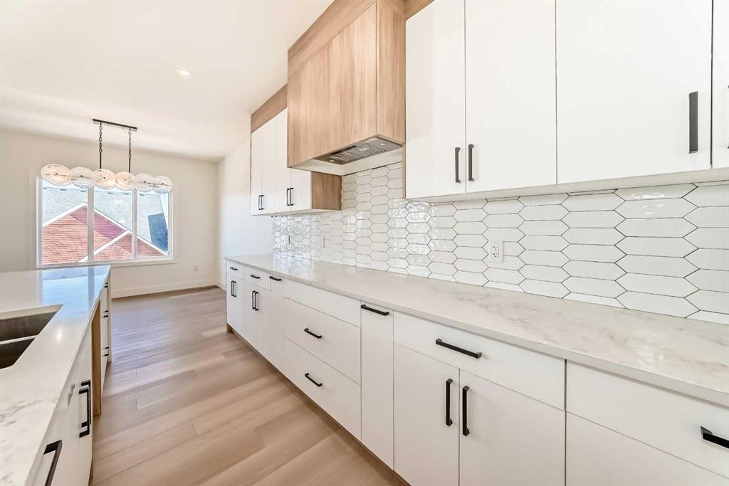 407 Rivercrest Road, Cochrane, AB - Indoor Photo Showing Kitchen With Double Sink