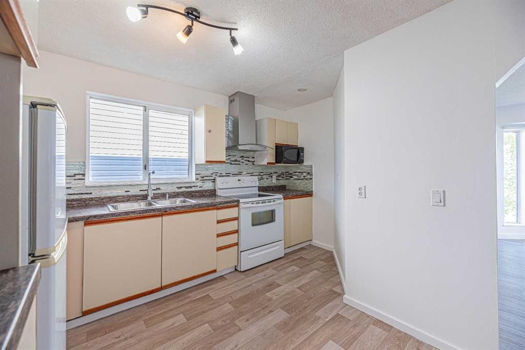 14 Martindale Mews Ne, Calgary, AB - Indoor Photo Showing Kitchen With Double Sink