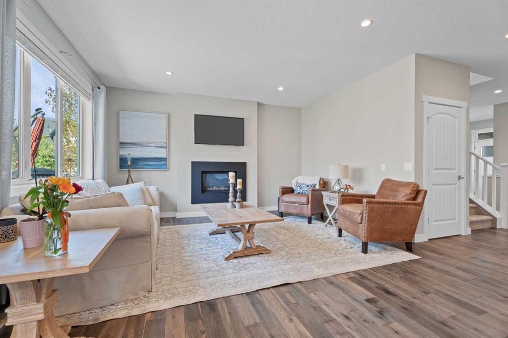 19 Masters Mews Se, Calgary, AB - Indoor Photo Showing Living Room With Fireplace