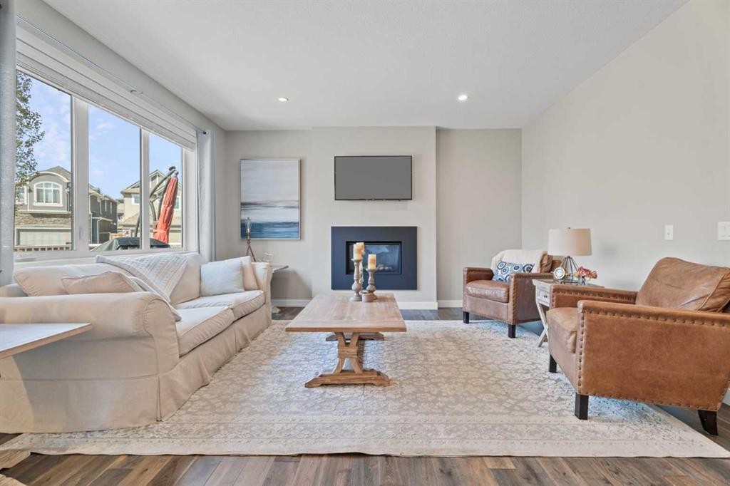 19 Masters Mews Se, Calgary, AB - Indoor Photo Showing Living Room With Fireplace