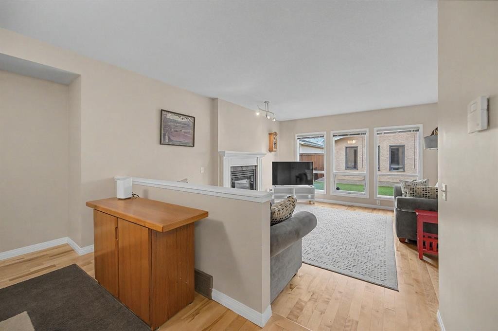 1206 19 Avenue Nw, Calgary, AB - Indoor Photo Showing Living Room With Fireplace