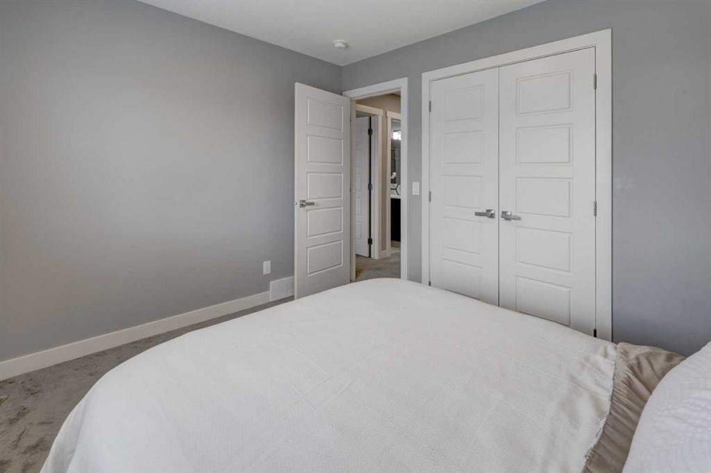 154 Amblehurst Way Nw, Calgary, AB - Indoor Photo Showing Bedroom