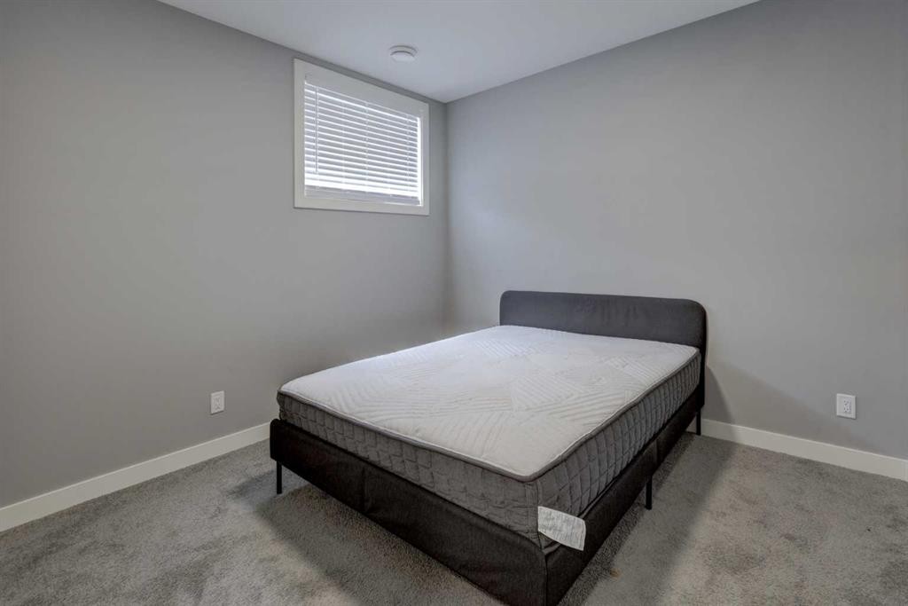 154 Amblehurst Way Nw, Calgary, AB - Indoor Photo Showing Bedroom