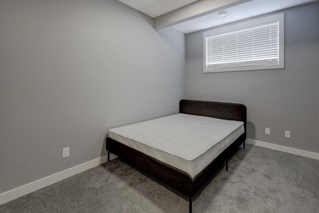 154 Amblehurst Way Nw, Calgary, AB - Indoor Photo Showing Bedroom