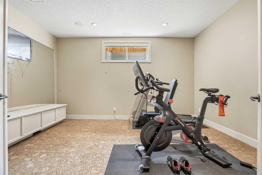 149 Aspen Glen Place Sw, Calgary, AB - Indoor Photo Showing Gym Room
