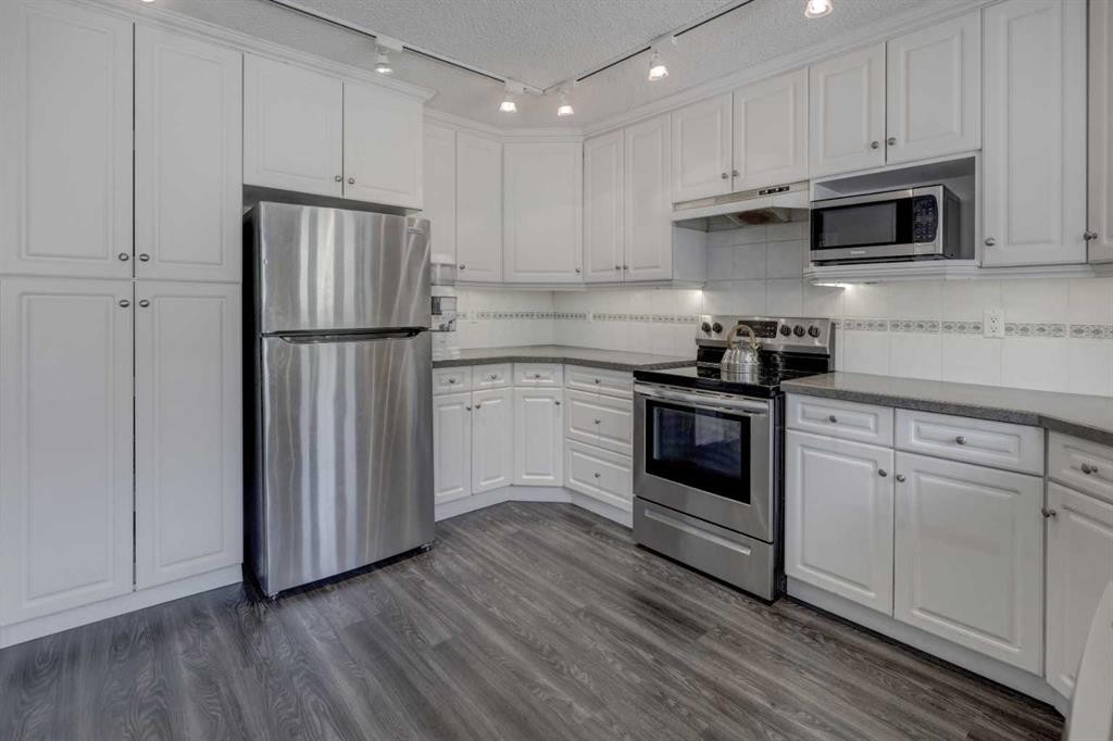 36 Hawksley Crescent Nw, Calgary, AB - Indoor Photo Showing Kitchen With Stainless Steel Kitchen