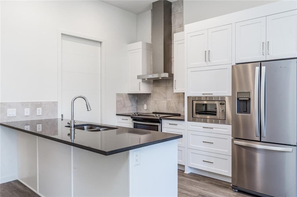109-12 Mahogany Path Se, Calgary, AB - Indoor Photo Showing Kitchen With Stainless Steel Kitchen With Double Sink With Upgraded Kitchen