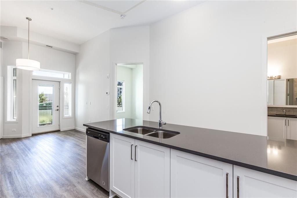 109-12 Mahogany Path Se, Calgary, AB - Indoor Photo Showing Kitchen With Double Sink