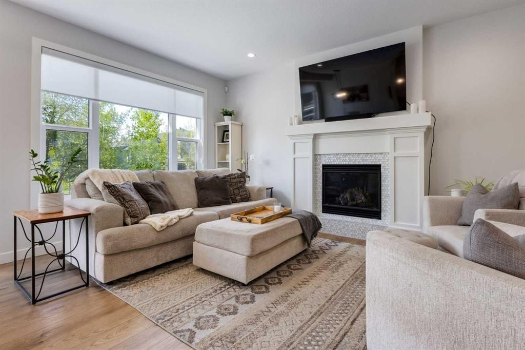 77 Walgrove Gardens Se, Calgary, AB - Indoor Photo Showing Living Room With Fireplace