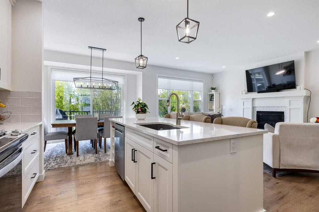 77 Walgrove Gardens Se, Calgary, AB - Indoor Photo Showing Kitchen With Fireplace With Upgraded Kitchen