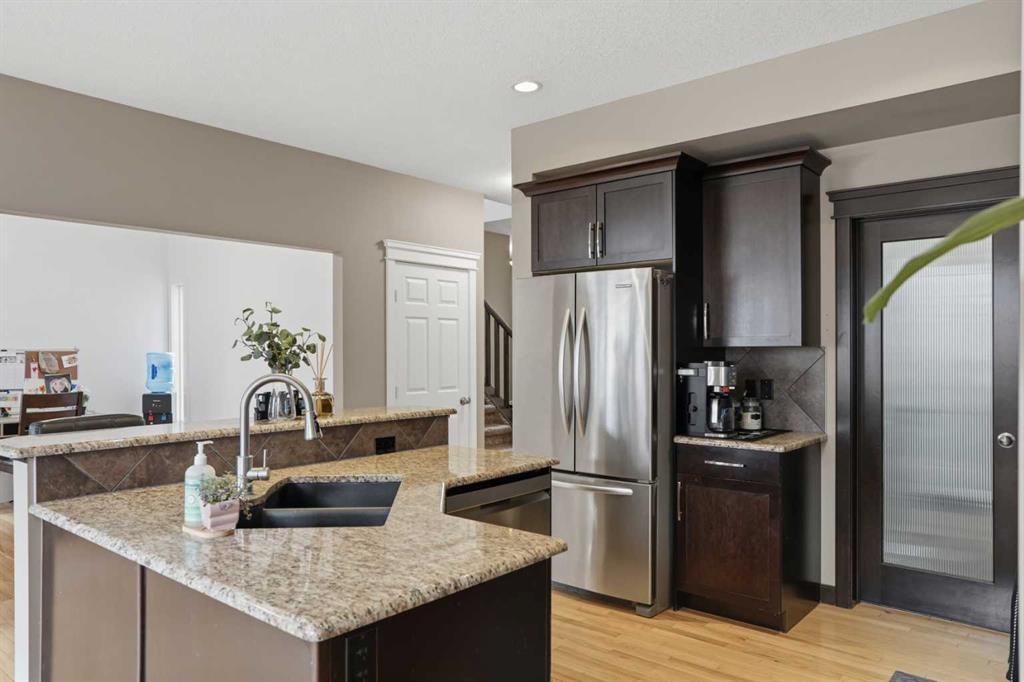 44 Westridge Crescent, Okotoks, AB - Indoor Photo Showing Kitchen With Stainless Steel Kitchen With Double Sink