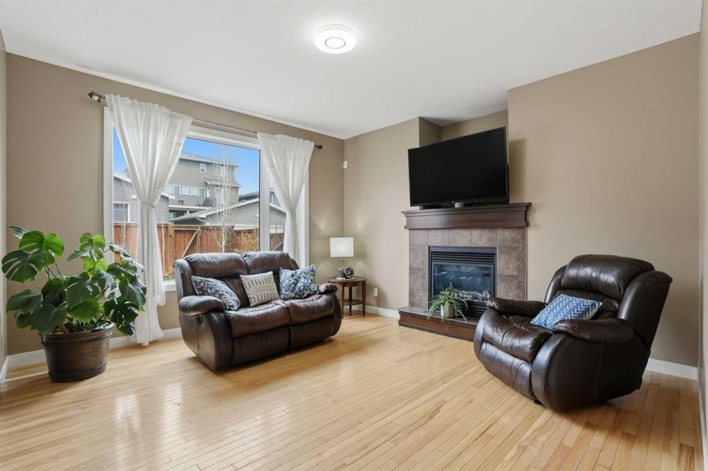 44 Westridge Crescent, Okotoks, AB - Indoor Photo Showing Living Room With Fireplace