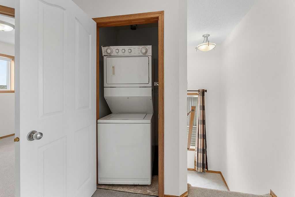 108 Everstone Rise Sw, Calgary, AB - Indoor Photo Showing Laundry Room
