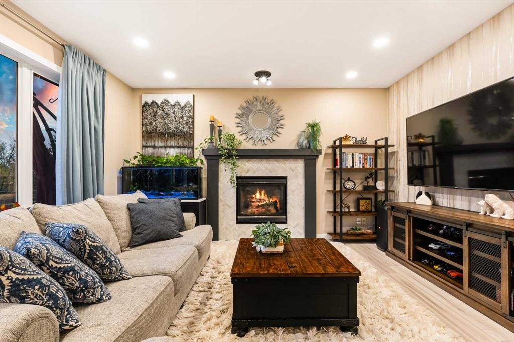 62 Panamount View Nw, Calgary, AB - Indoor Photo Showing Living Room With Fireplace