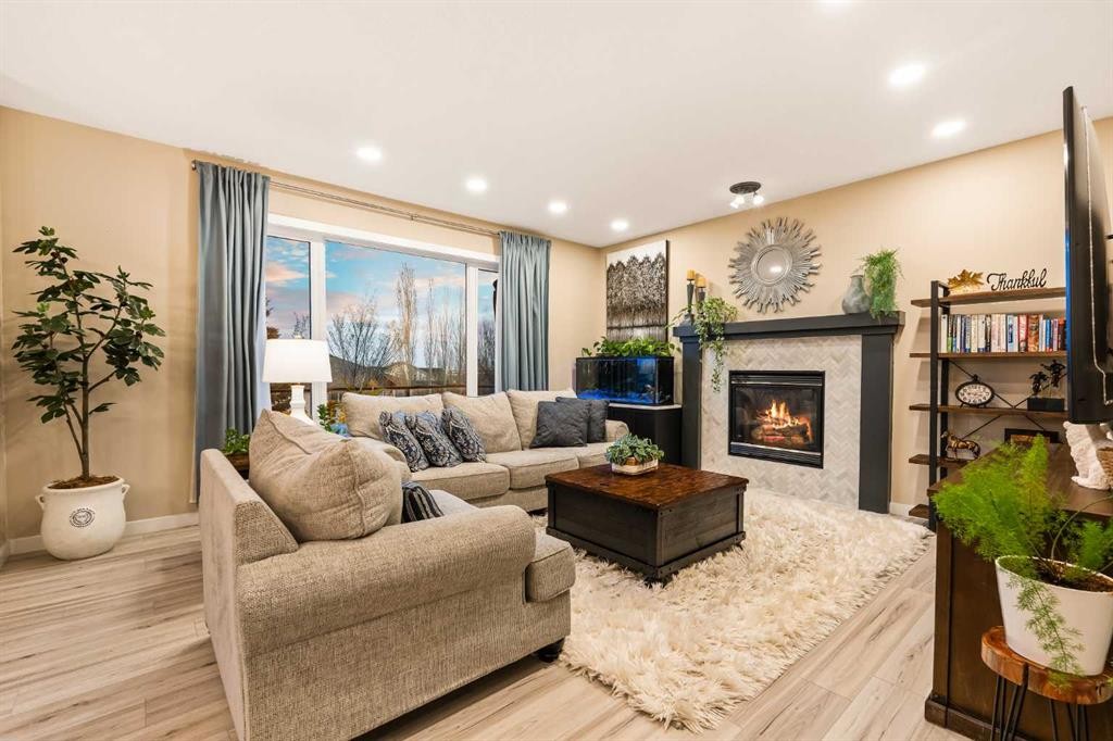 62 Panamount View Nw, Calgary, AB - Indoor Photo Showing Living Room With Fireplace