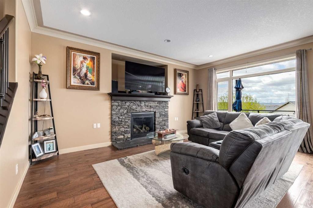 7 Sunset Way, Cochrane, AB - Indoor Photo Showing Living Room With Fireplace