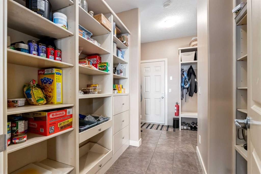 7 Sunset Way, Cochrane, AB - Indoor With Storage