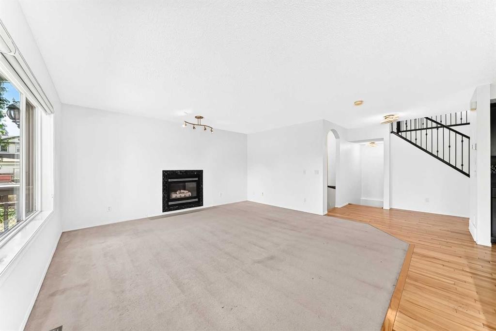 6 Cougarstone Crescent Sw, Calgary, AB - Indoor With Fireplace