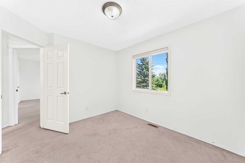 6 Cougarstone Crescent Sw, Calgary, AB - Indoor Photo Showing Other Room