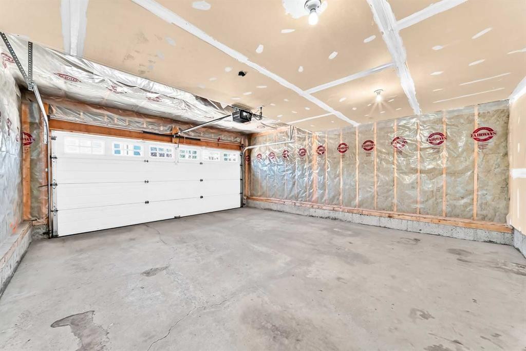 6 Cougarstone Crescent Sw, Calgary, AB - Indoor Photo Showing Garage