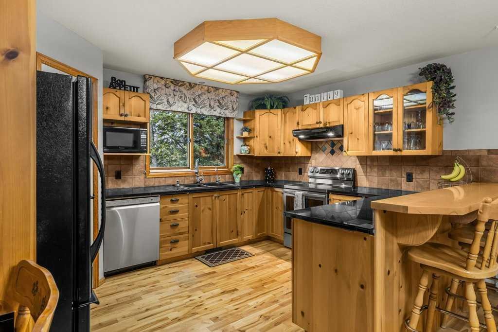 146 Cougar Point Road, Canmore, AB - Indoor Photo Showing Kitchen With Double Sink