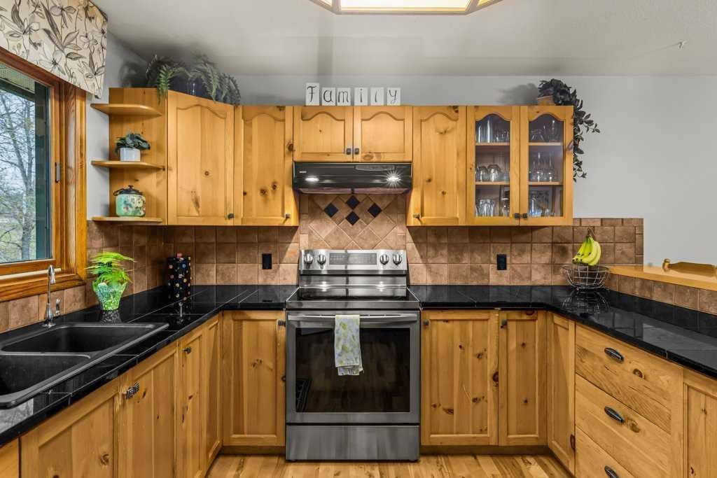 146 Cougar Point Road, Canmore, AB - Indoor Photo Showing Kitchen With Double Sink