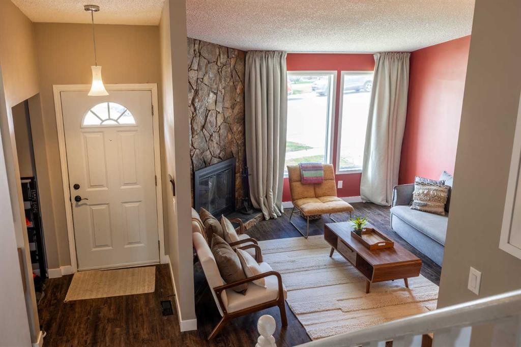 6716 Ranchview Drive Nw, Calgary, AB - Indoor Photo Showing Living Room With Fireplace