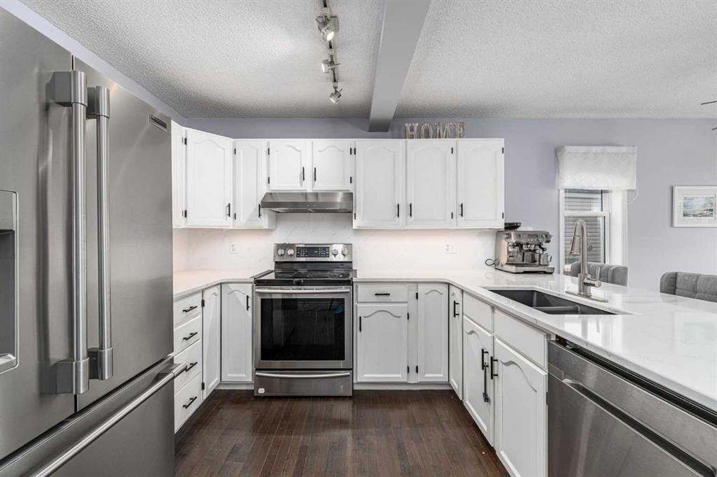 381 Hidden Valley Manor Nw, Calgary, AB - Indoor Photo Showing Kitchen With Stainless Steel Kitchen With Double Sink