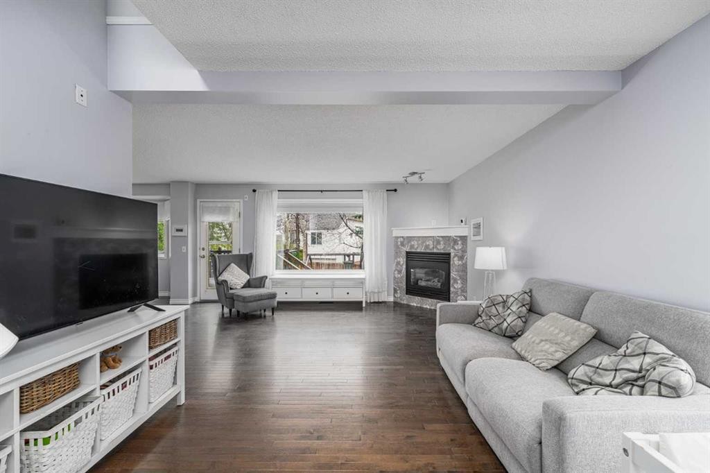 381 Hidden Valley Manor Nw, Calgary, AB - Indoor Photo Showing Living Room With Fireplace