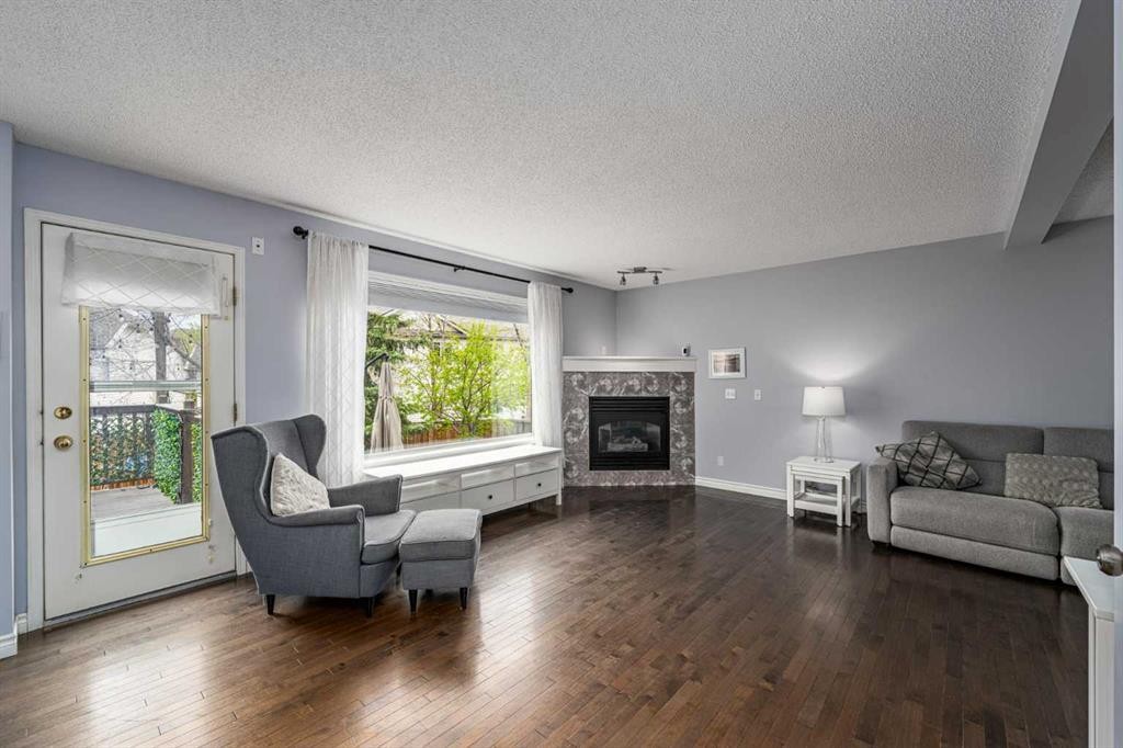 381 Hidden Valley Manor Nw, Calgary, AB - Indoor Photo Showing Living Room With Fireplace