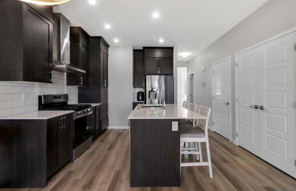 101-Dawson Drive, Chestermere, AB - Indoor Photo Showing Kitchen With Upgraded Kitchen