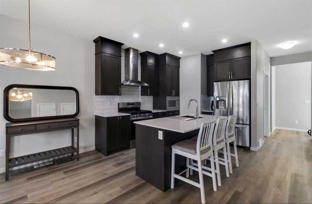 101-Dawson Drive, Chestermere, AB - Indoor Photo Showing Kitchen With Upgraded Kitchen