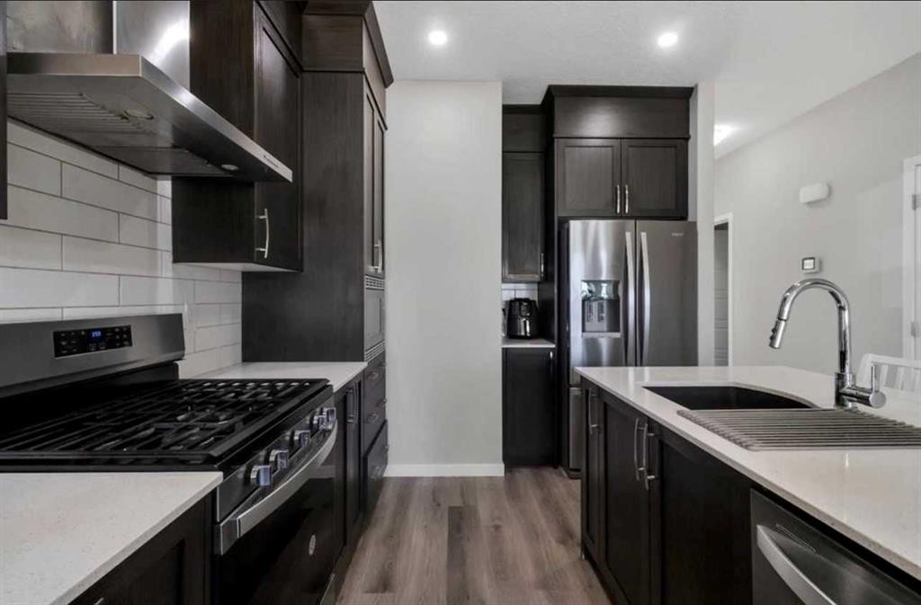 101-Dawson Drive, Chestermere, AB - Indoor Photo Showing Kitchen With Upgraded Kitchen