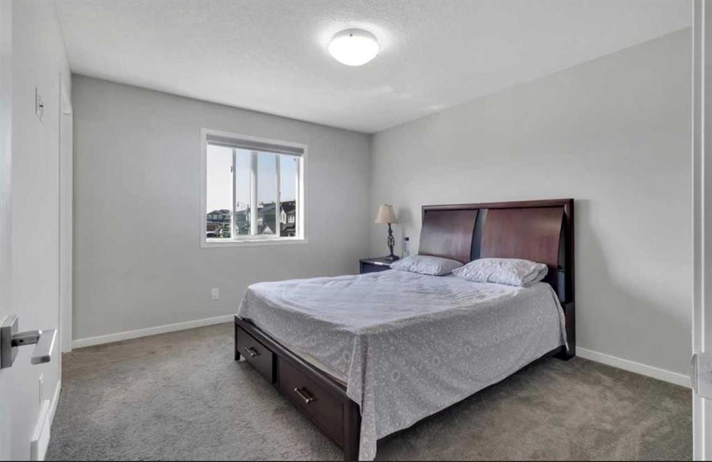 101-Dawson Drive, Chestermere, AB - Indoor Photo Showing Bedroom