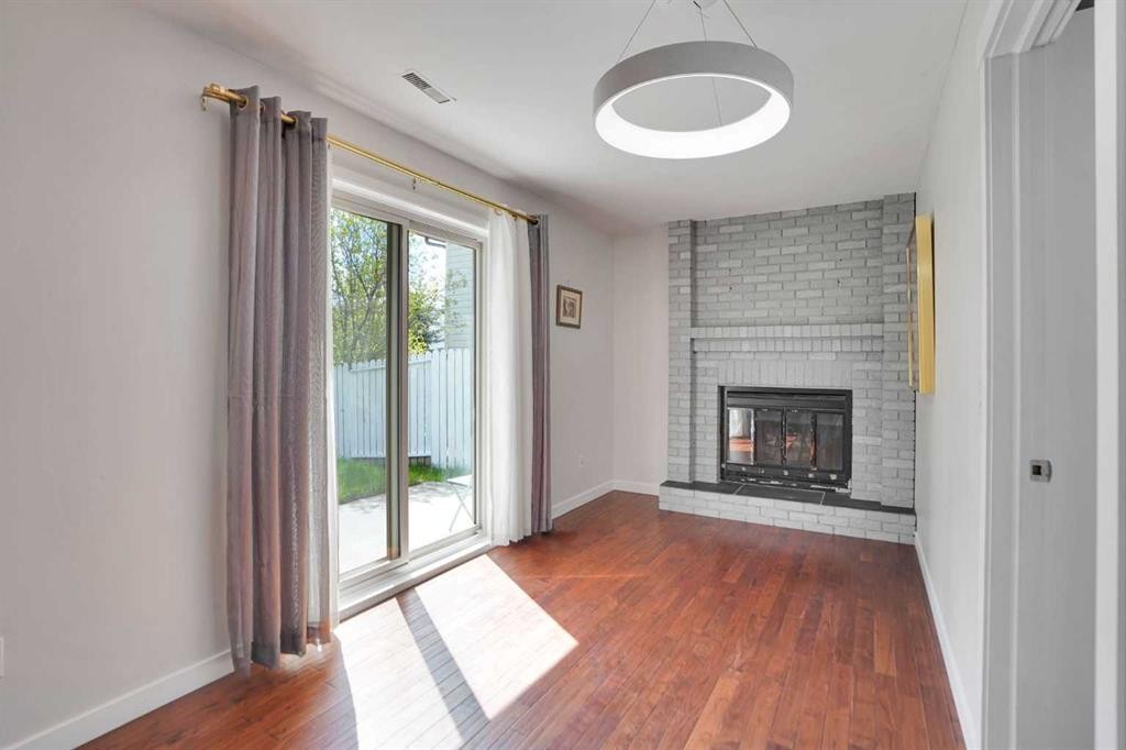127 Woodstock Road Sw, Calgary, AB - Indoor With Fireplace