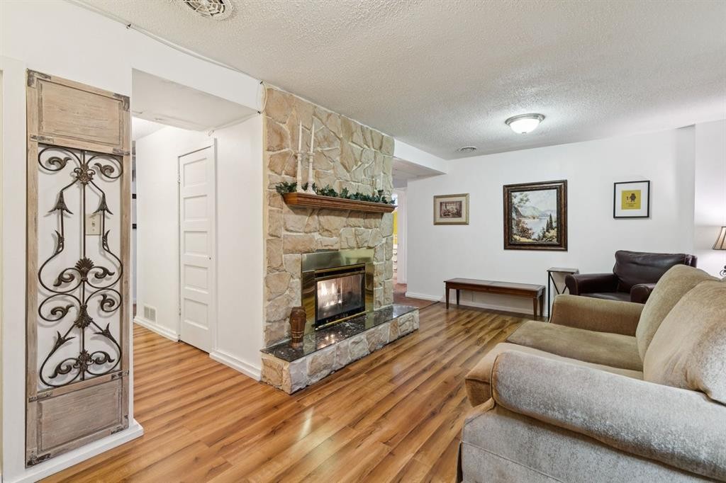 2048 26 Street Se, Calgary, AB - Indoor Photo Showing Living Room With Fireplace