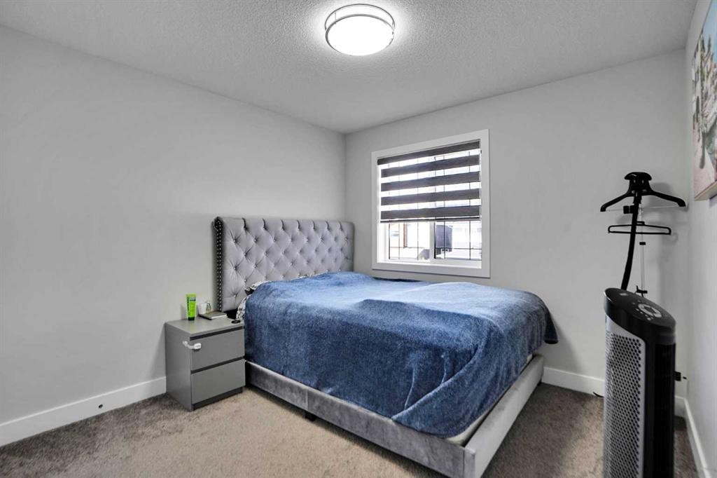 3 Rivercrest Common, Cochrane, AB - Indoor Photo Showing Bedroom
